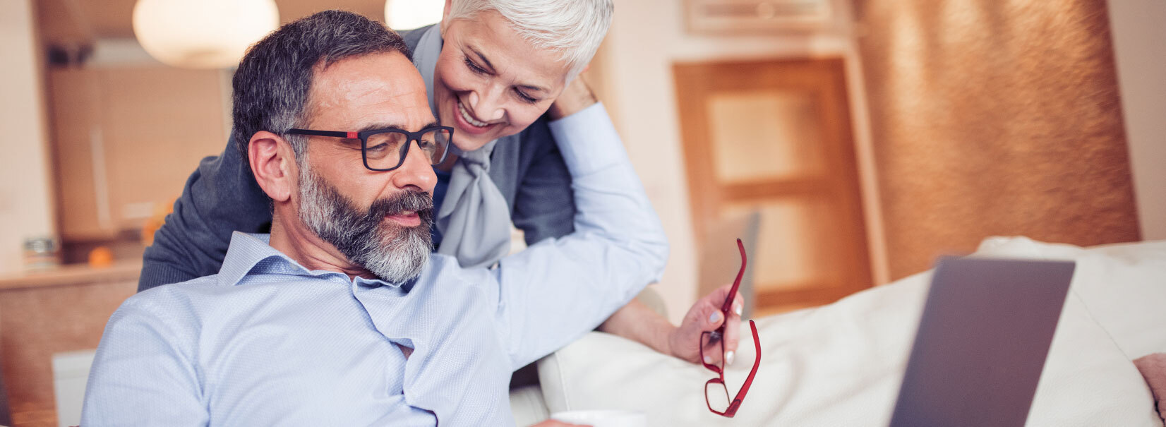 Man and women looking at a laptop