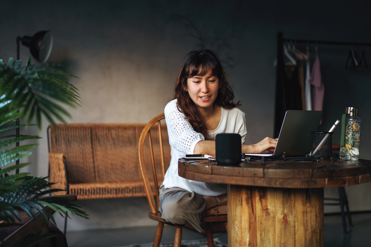 Women sitting at a wooden table working