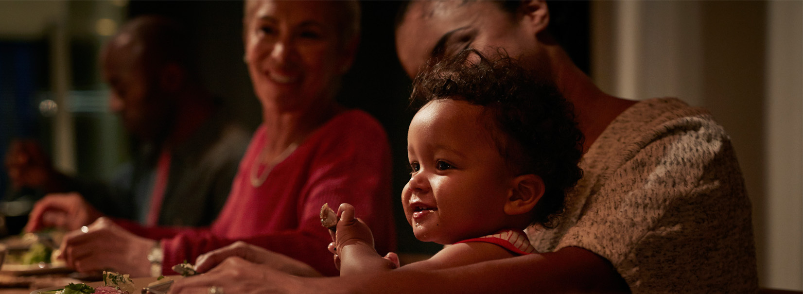 Child sitting on their mothers lap