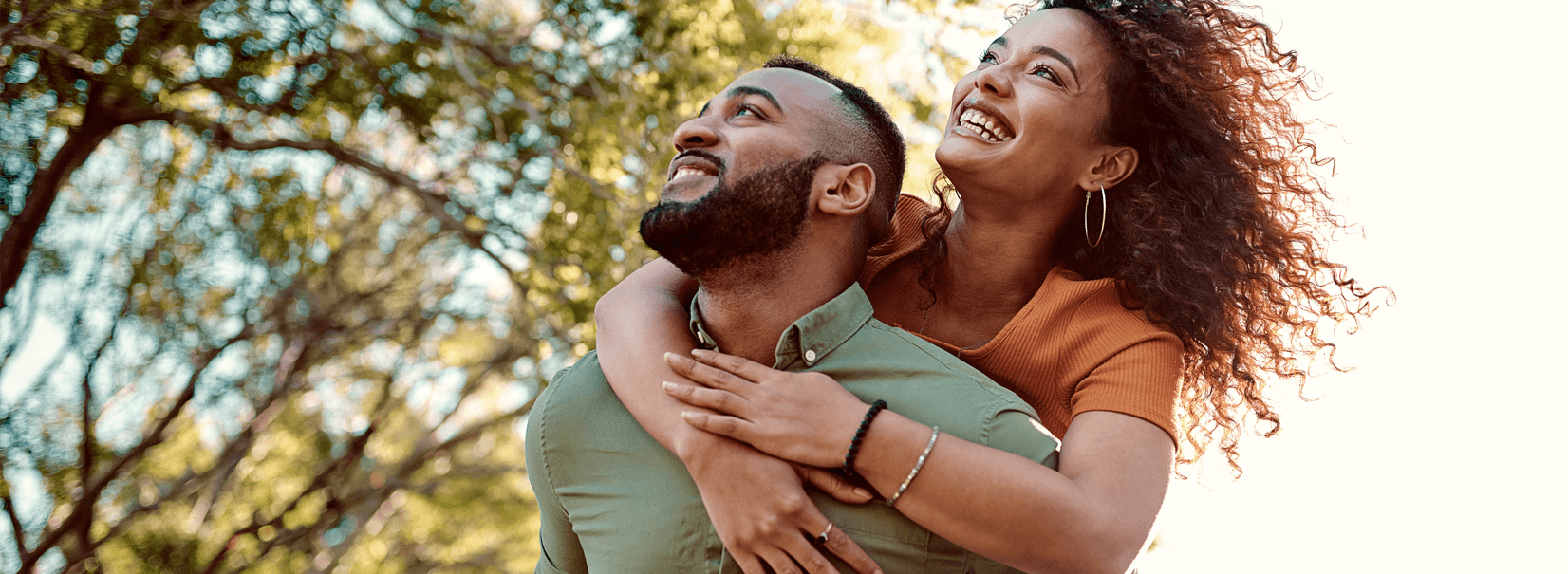 young couple smiling and hugging