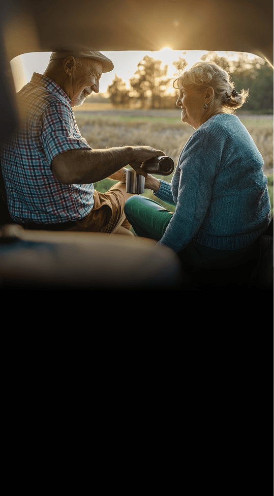 Elderly couple sitting in a caravan