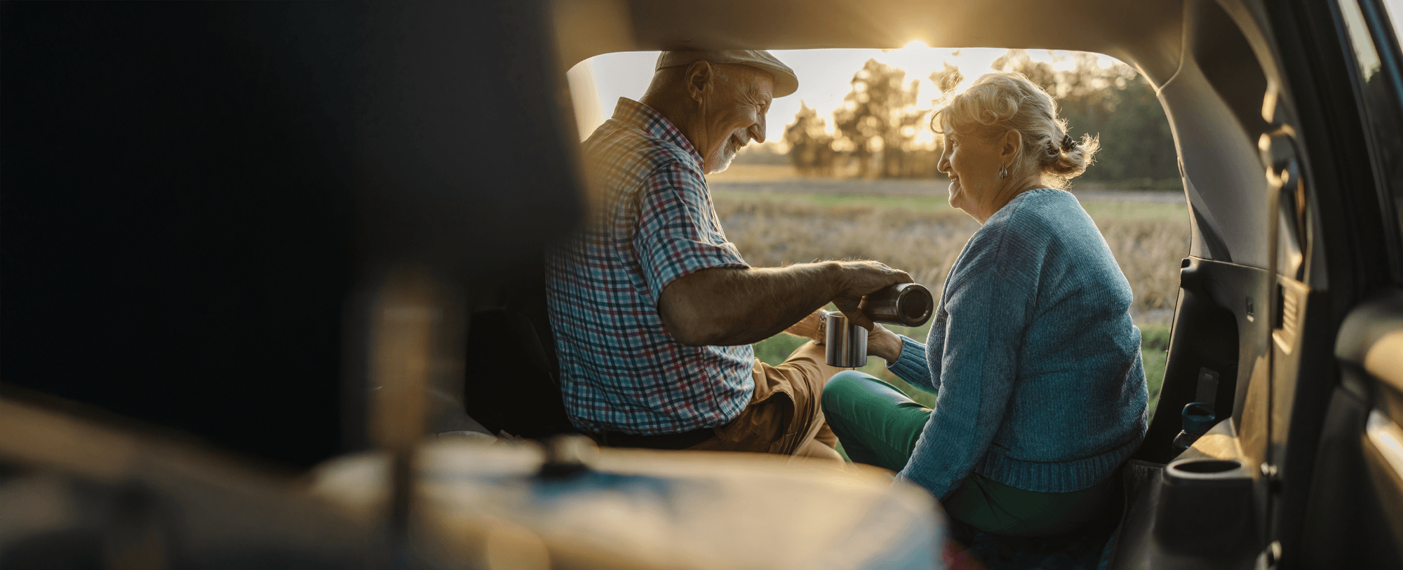 Elderly couple sitting in a caravan