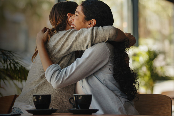 Two women hugging