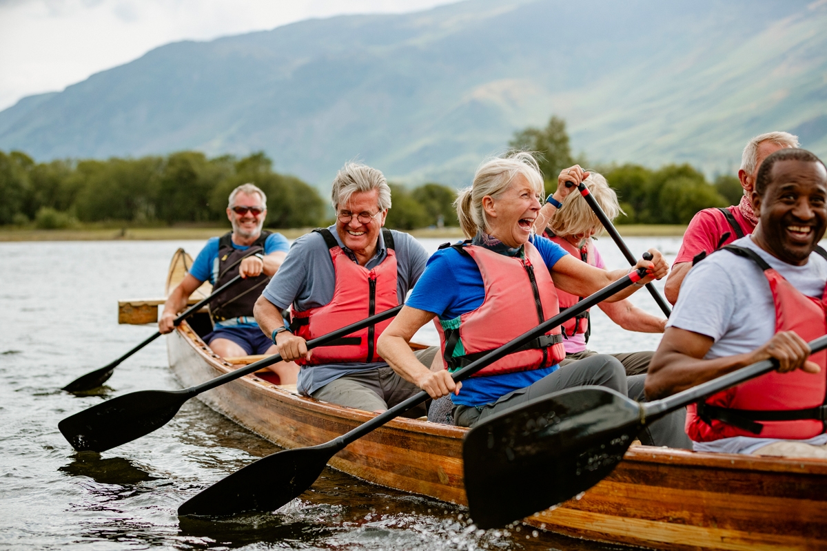 Men and women canoeing in a lake