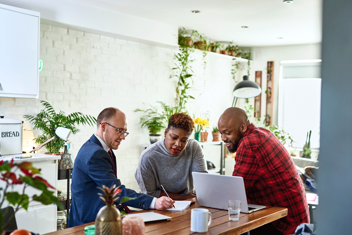 Man and women speaking to a financial adviser